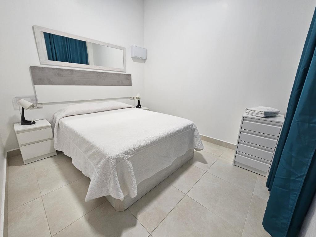 Posteľ alebo postele v izbe v ubytovaní Alojame Valencia