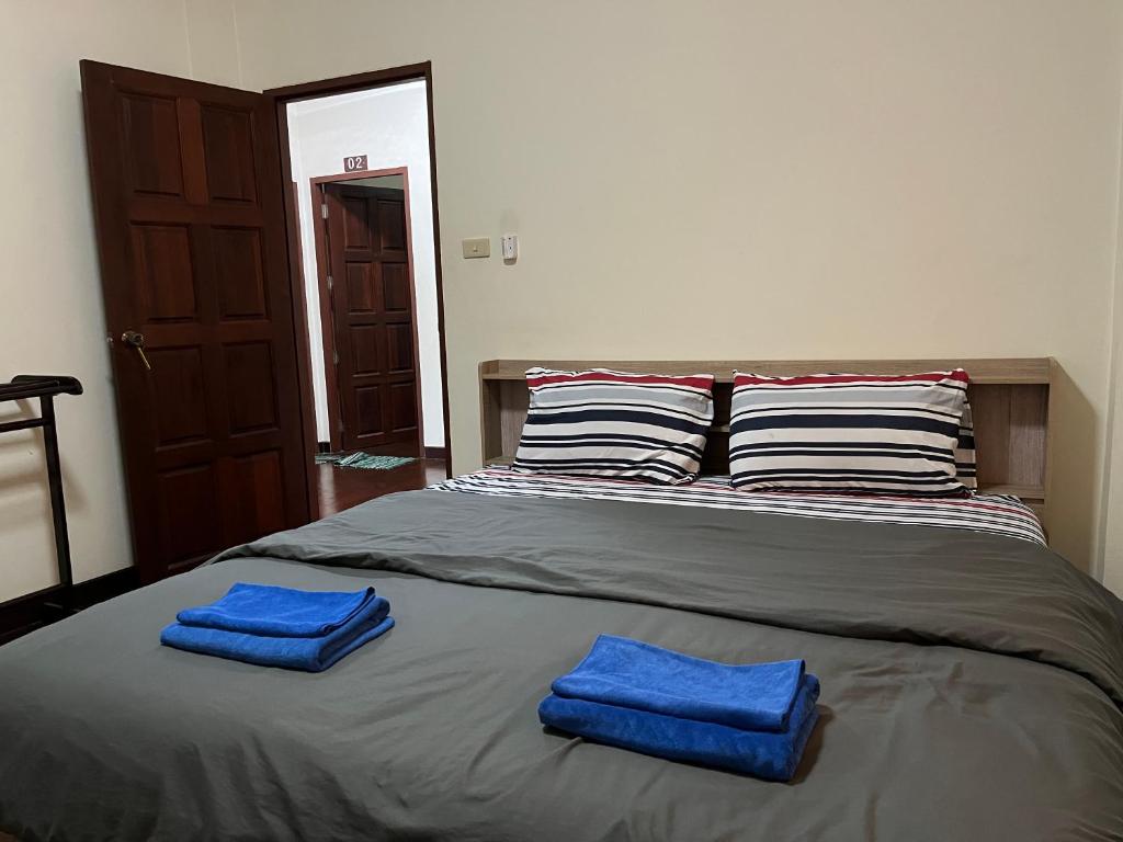 Postel nebo postele na pokoji v ubytování Poolvilla Armthong Home