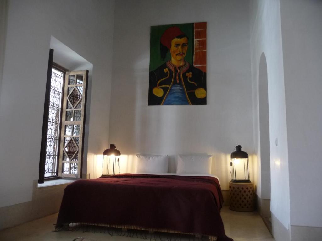 Un pat sau paturi într-o cameră la Riad Matham