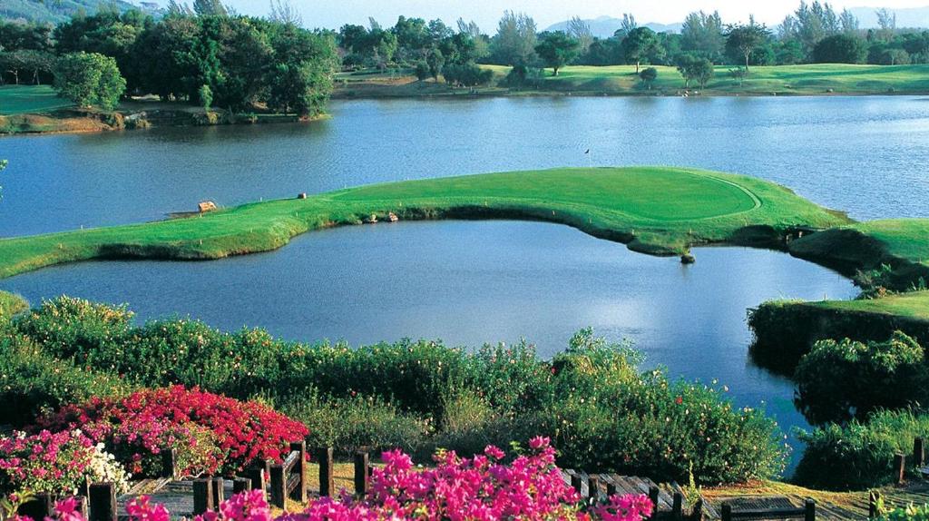 a golf course in the middle of a lake at Happy Place Official in Nai Yang Beach