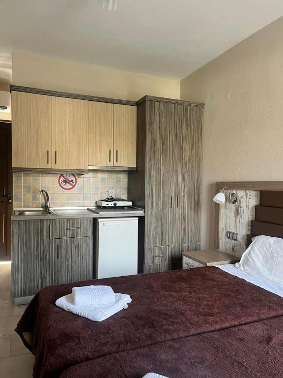 Kuchyň nebo kuchyňský kout v ubytování SUNSET HOTEL