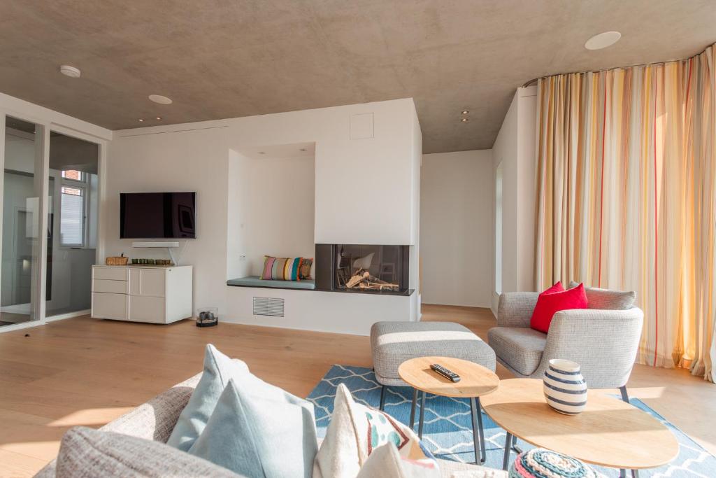 TV a/nebo společenská místnost v ubytování Strandhaus