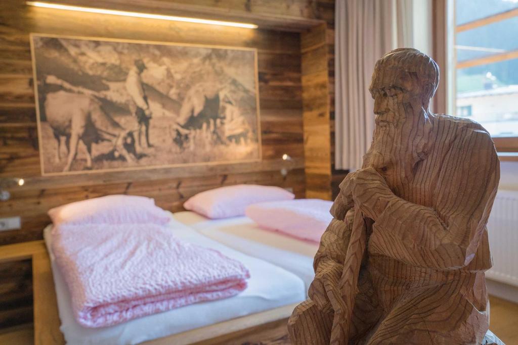 Postel nebo postele na pokoji v ubytování Atelier Garni Astei