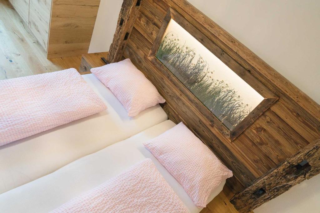 Postel nebo postele na pokoji v ubytování Atelier Garni Astei