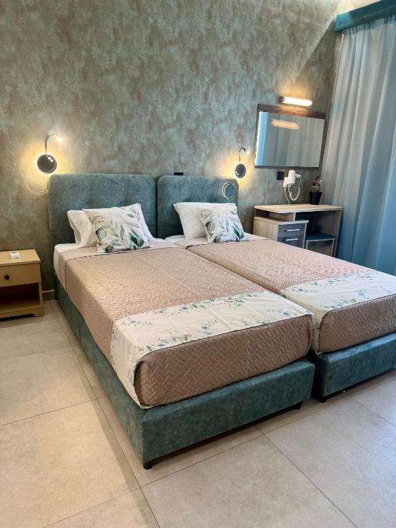 Letto o letti in una camera di Dionysos Studios