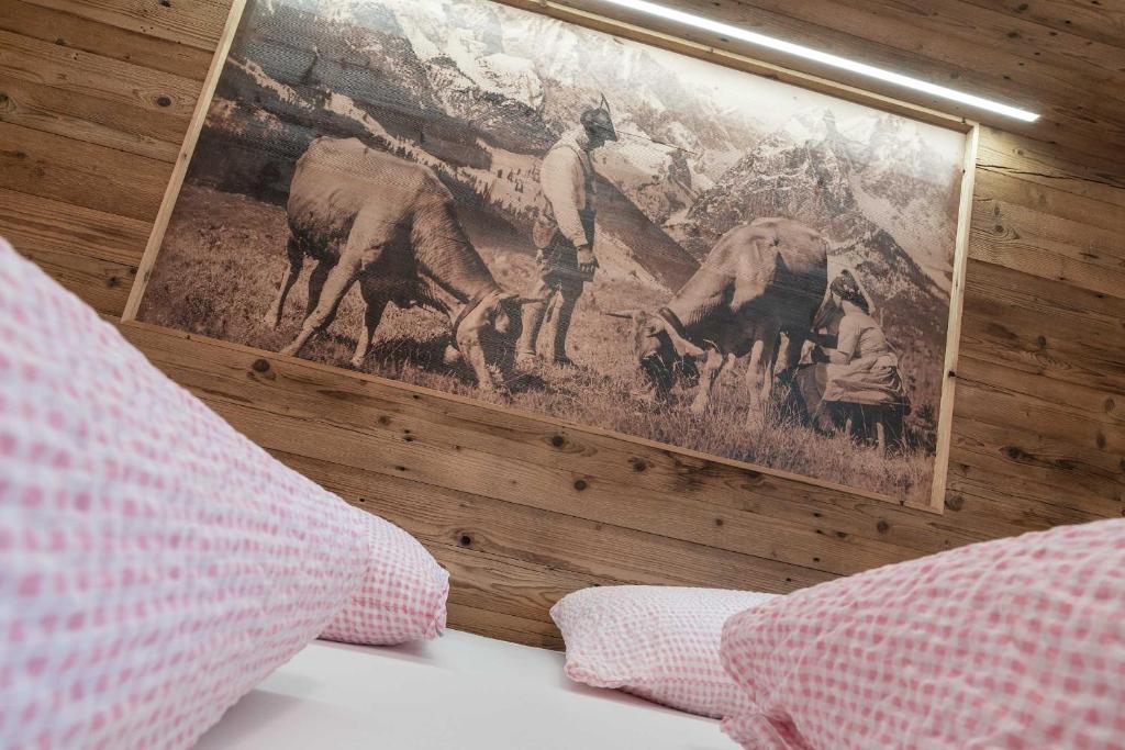 Postel nebo postele na pokoji v ubytování Atelier Garni Astei