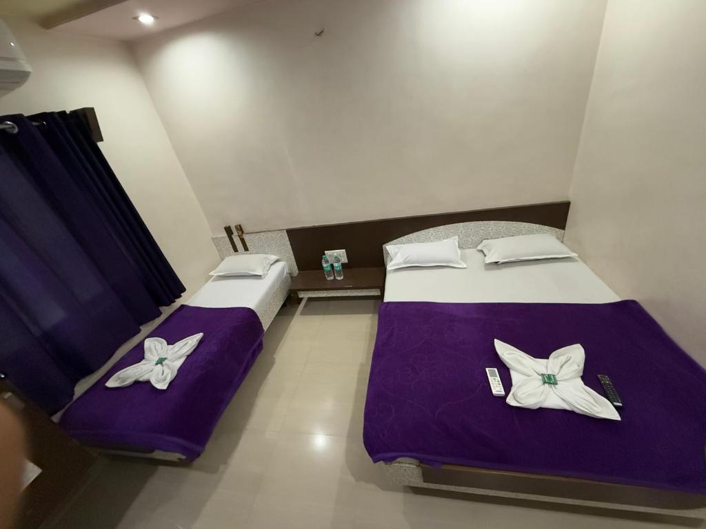 Postel nebo postele na pokoji v ubytování Hotel Temple Sai