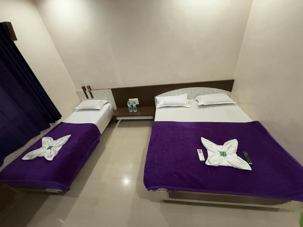 Postel nebo postele na pokoji v ubytování Hotel Temple Sai