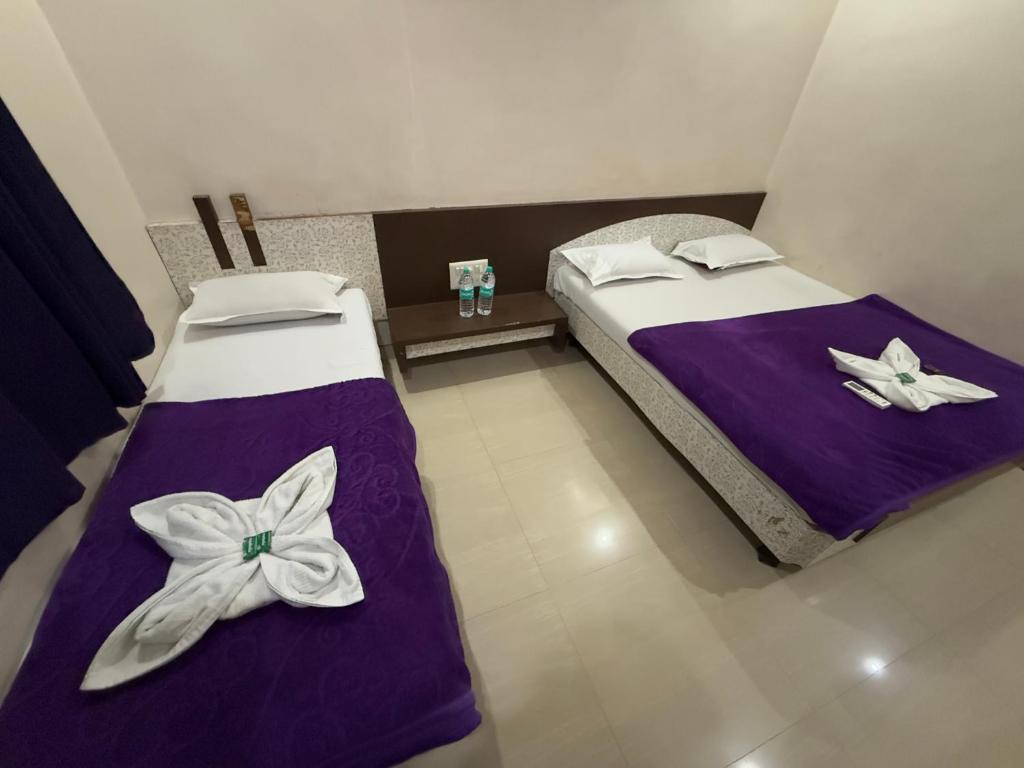 Postel nebo postele na pokoji v ubytování Hotel Temple Sai
