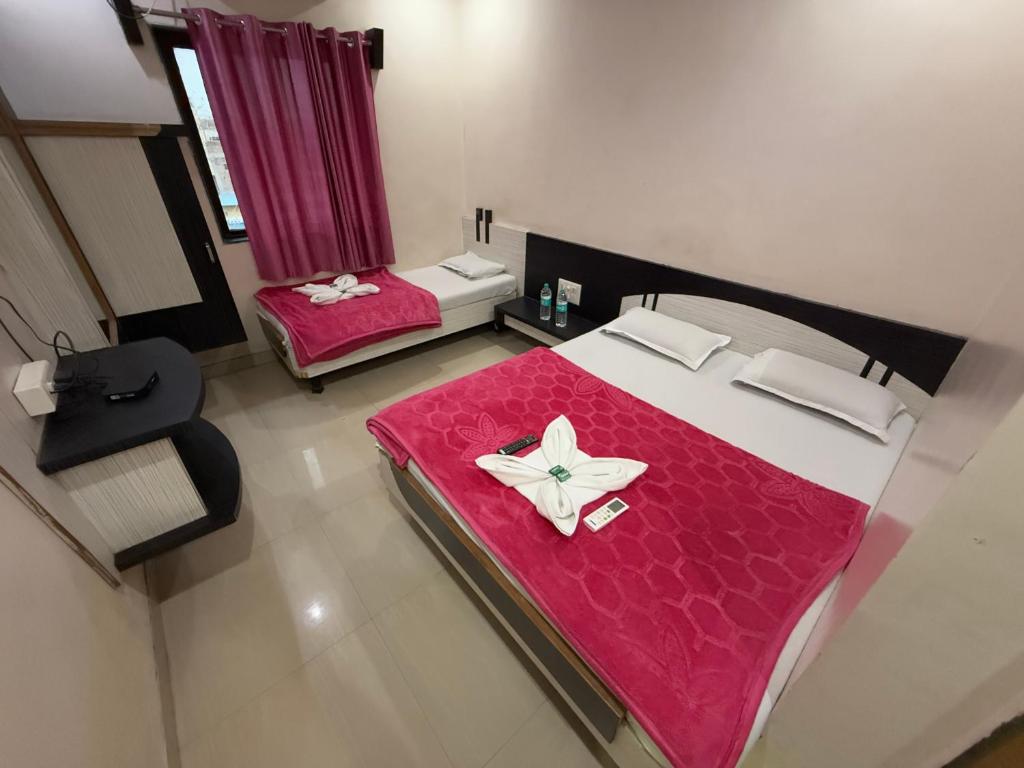 Postel nebo postele na pokoji v ubytování Hotel Temple Sai