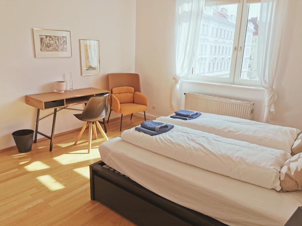 Uma cama ou camas num quarto em Vienna Experience
