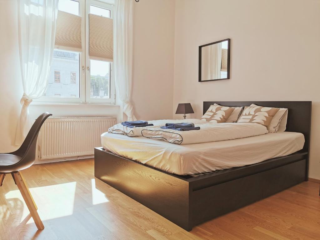 Uma cama ou camas num quarto em Vienna Experience