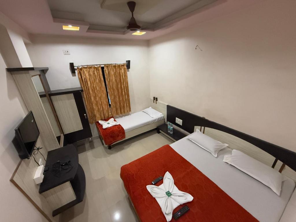 Postel nebo postele na pokoji v ubytování Hotel Temple Sai