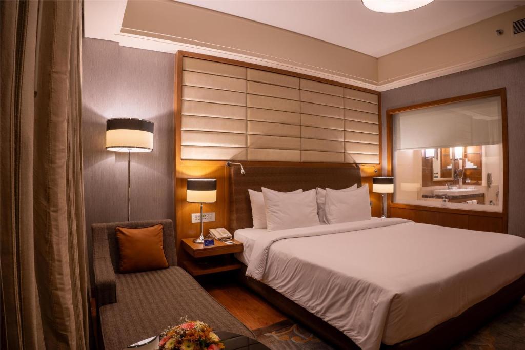 Postel nebo postele na pokoji v ubytování Radisson Blu Hotel, Nagpur