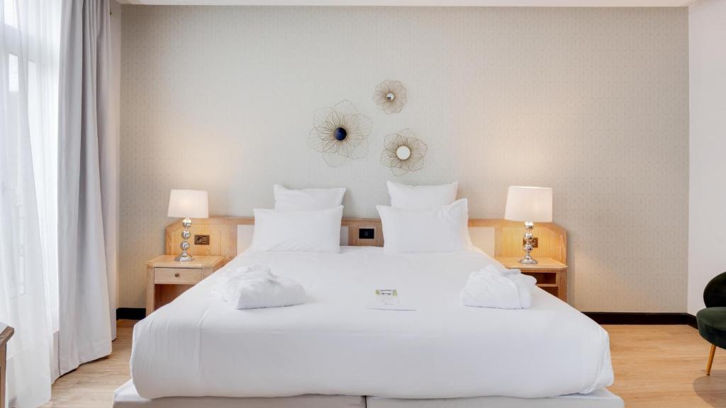 Postel nebo postele na pokoji v ubytování Best Western Plus Le Picardy