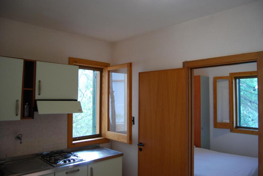 Kuchyň nebo kuchyňský kout v ubytování Villaggio Mascia
