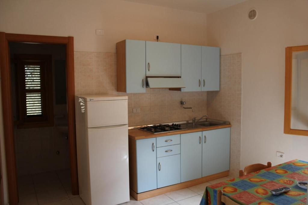 Kuchyň nebo kuchyňský kout v ubytování Villaggio Mascia