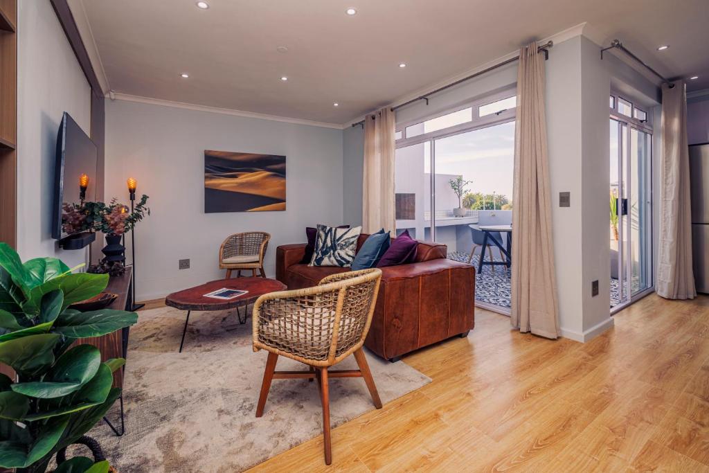 a living room with a couch and a table at C Breeze 2 & 11 in Swakopmund