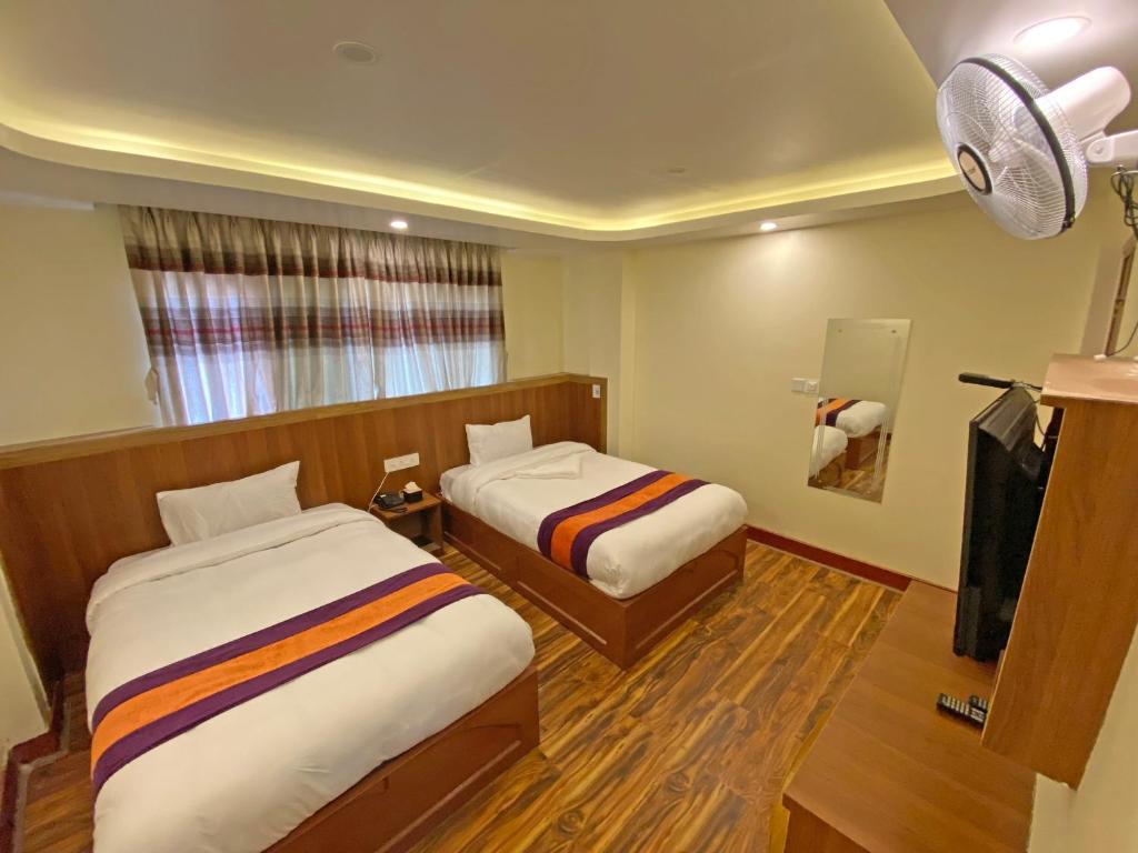 Voodi või voodid majutusasutuse Hotel Himalayan BTS toas