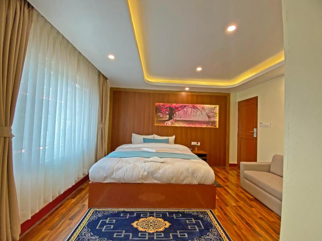 Voodi või voodid majutusasutuse Hotel Himalayan BTS toas
