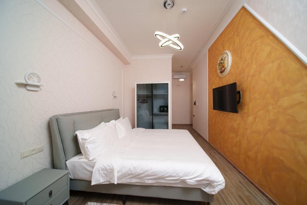 Postel nebo postele na pokoji v ubytování Emmanuel Hotel Yerevan
