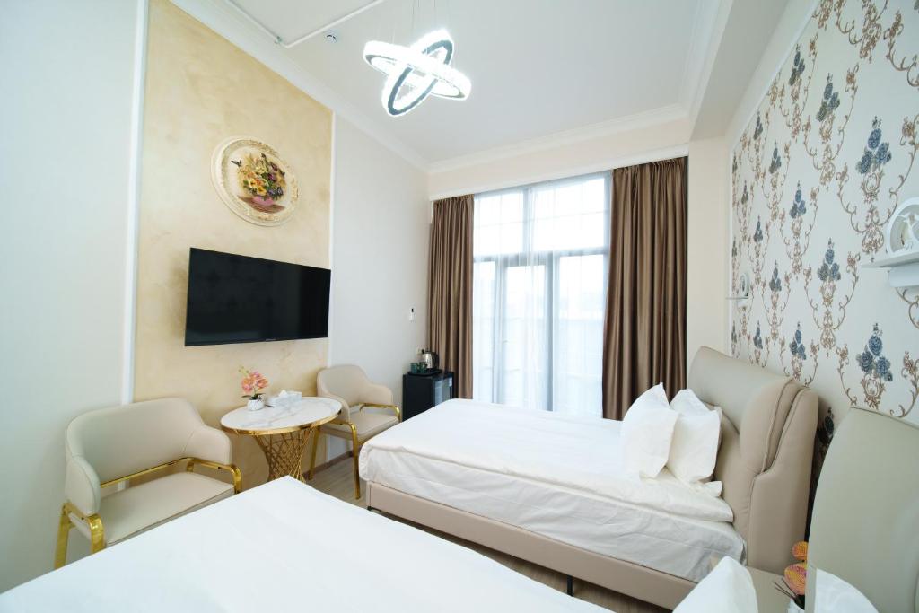 Postel nebo postele na pokoji v ubytování Emmanuel Hotel Yerevan