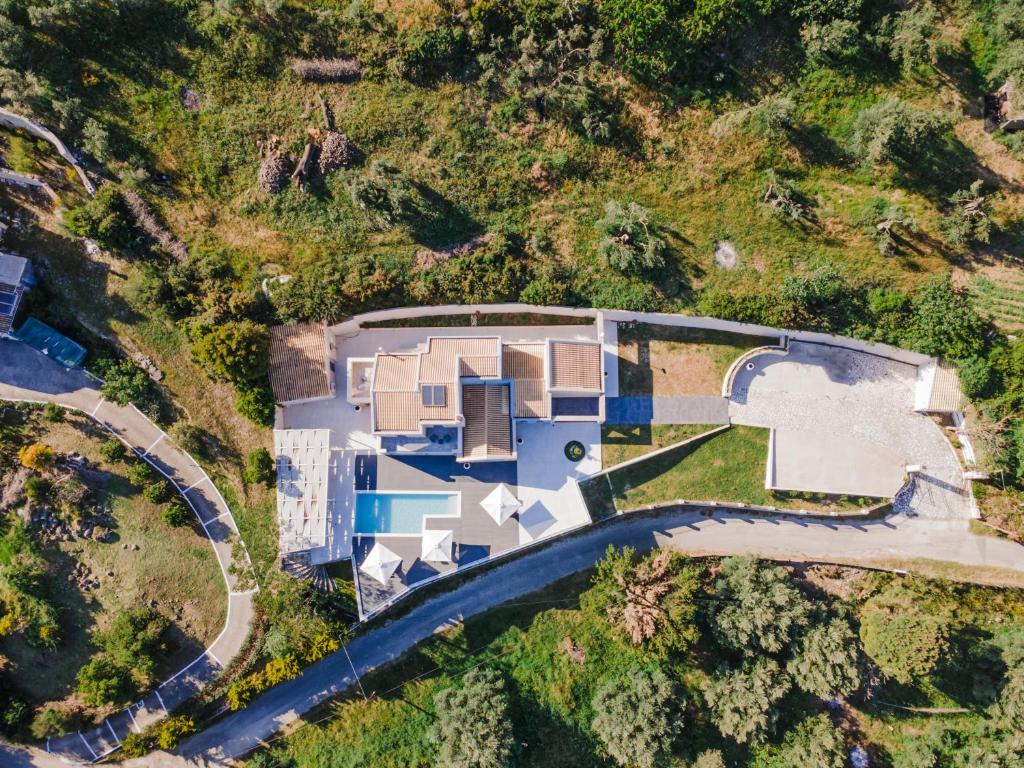 an aerial view of a house with a swimming pool at Villa Athina Corfu - 4 bedrooms in Kynopiástai