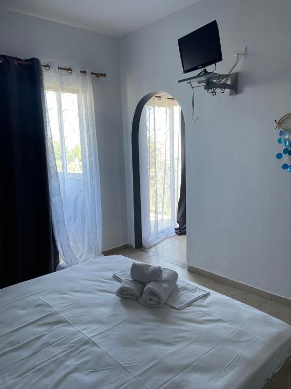Postel nebo postele na pokoji v ubytování Vesper Rooms