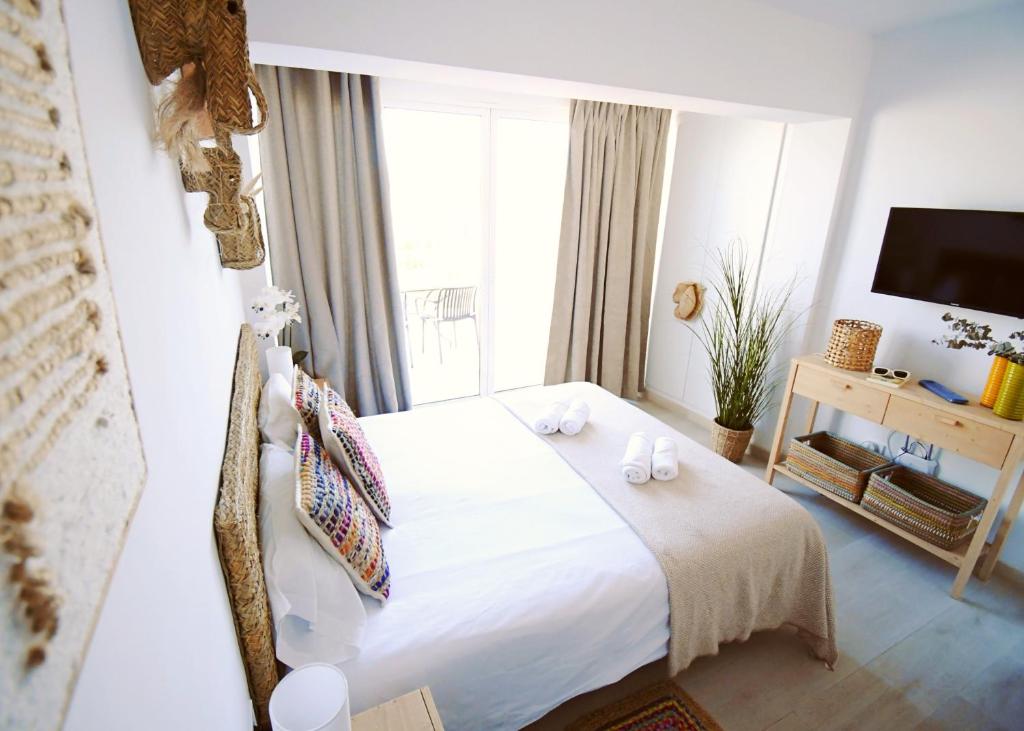 Postel nebo postele na pokoji v ubytování Apartamentos Strand Jávea