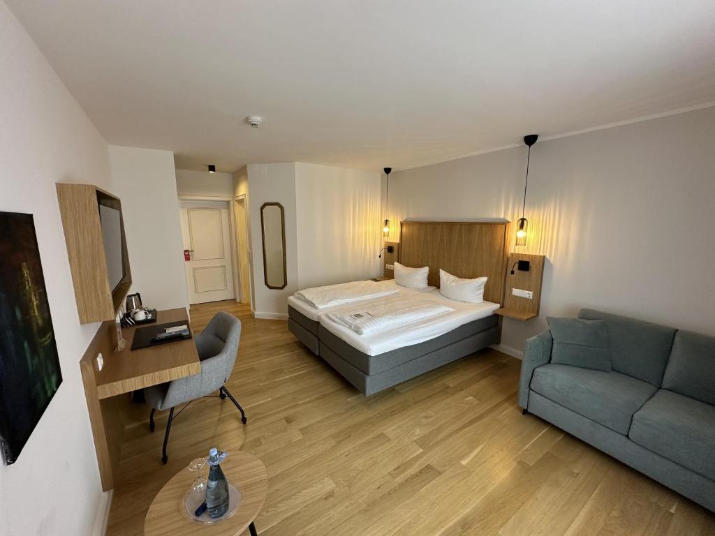 Postel nebo postele na pokoji v ubytování Hotel Pöker