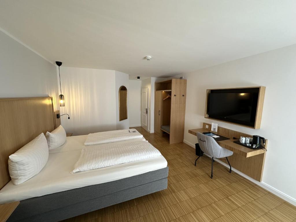 TV a/nebo společenská místnost v ubytování Hotel Pöker