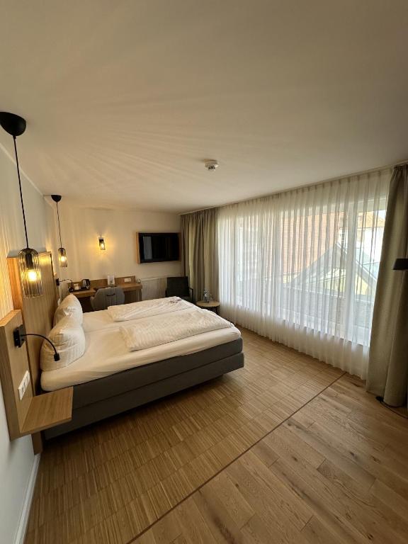 Postel nebo postele na pokoji v ubytování Hotel Pöker