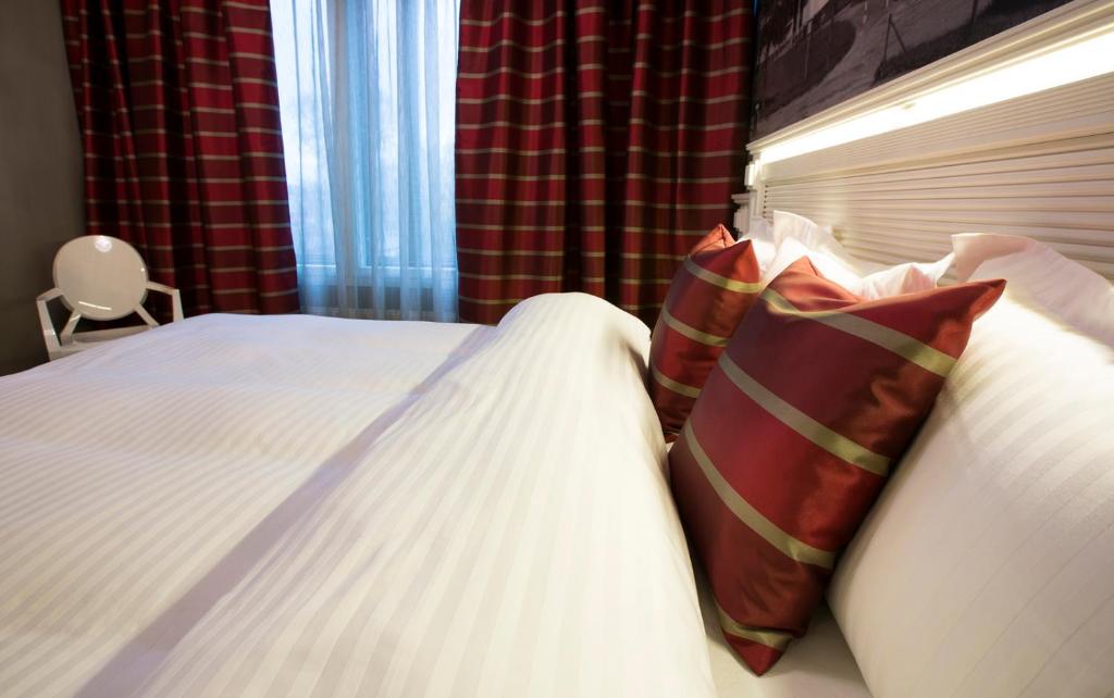 Postel nebo postele na pokoji v ubytování Hotelli Olof