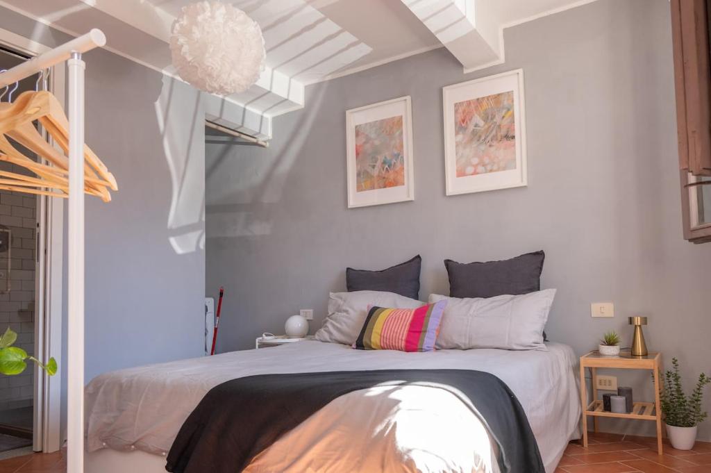 a bedroom with a bed in a room at Cozy Bruni House in Florence in Florence