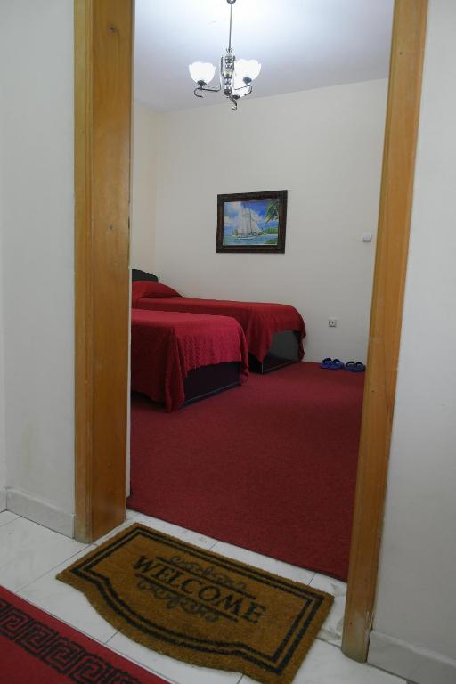 Postel nebo postele na pokoji v ubytování Hotel HAXHIU