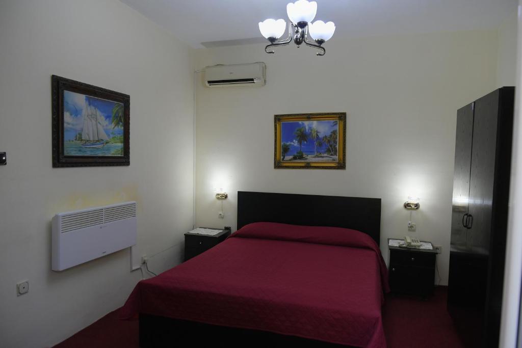 Postel nebo postele na pokoji v ubytování Hotel HAXHIU