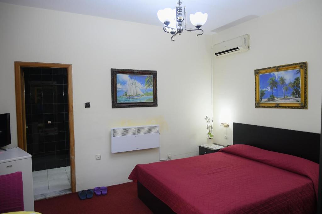 Postel nebo postele na pokoji v ubytování Hotel HAXHIU