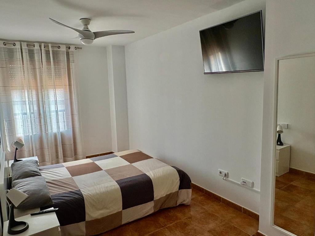 Posteľ alebo postele v izbe v ubytovaní Costa Esuri Golf y Playa III