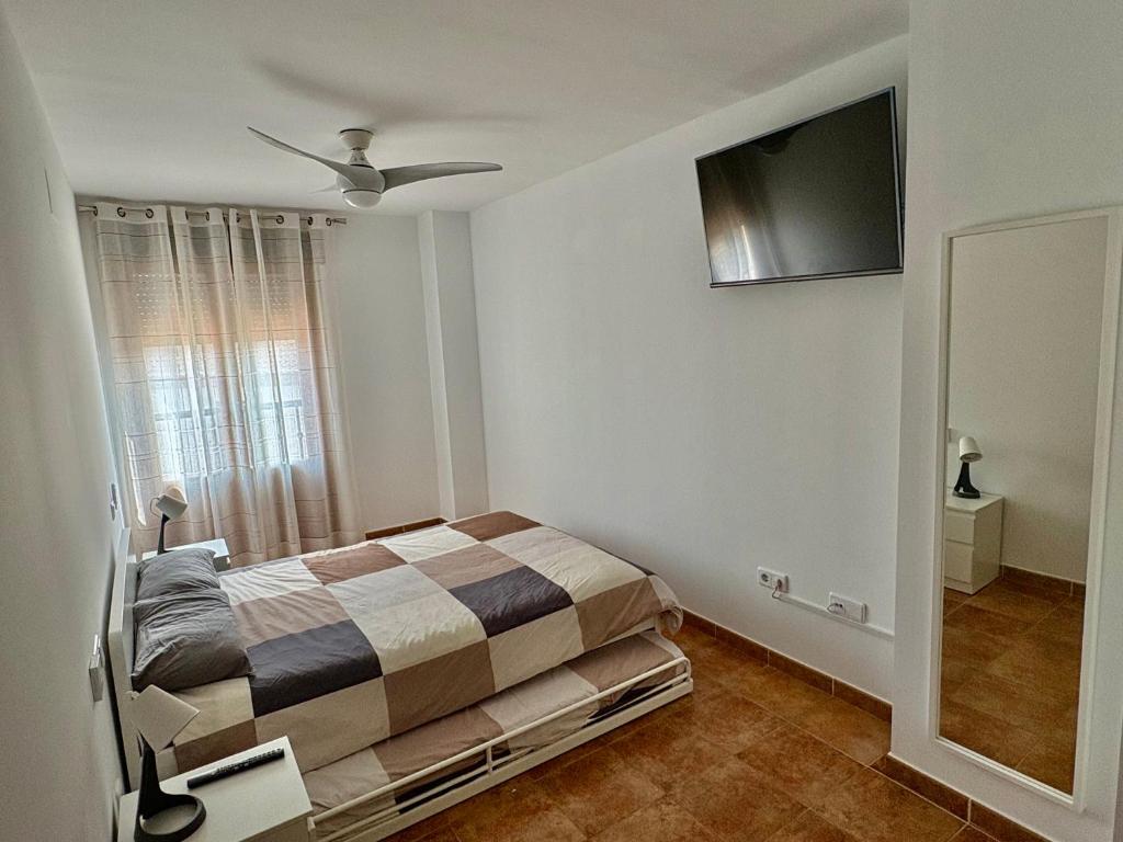 Posteľ alebo postele v izbe v ubytovaní Costa Esuri Golf y Playa III