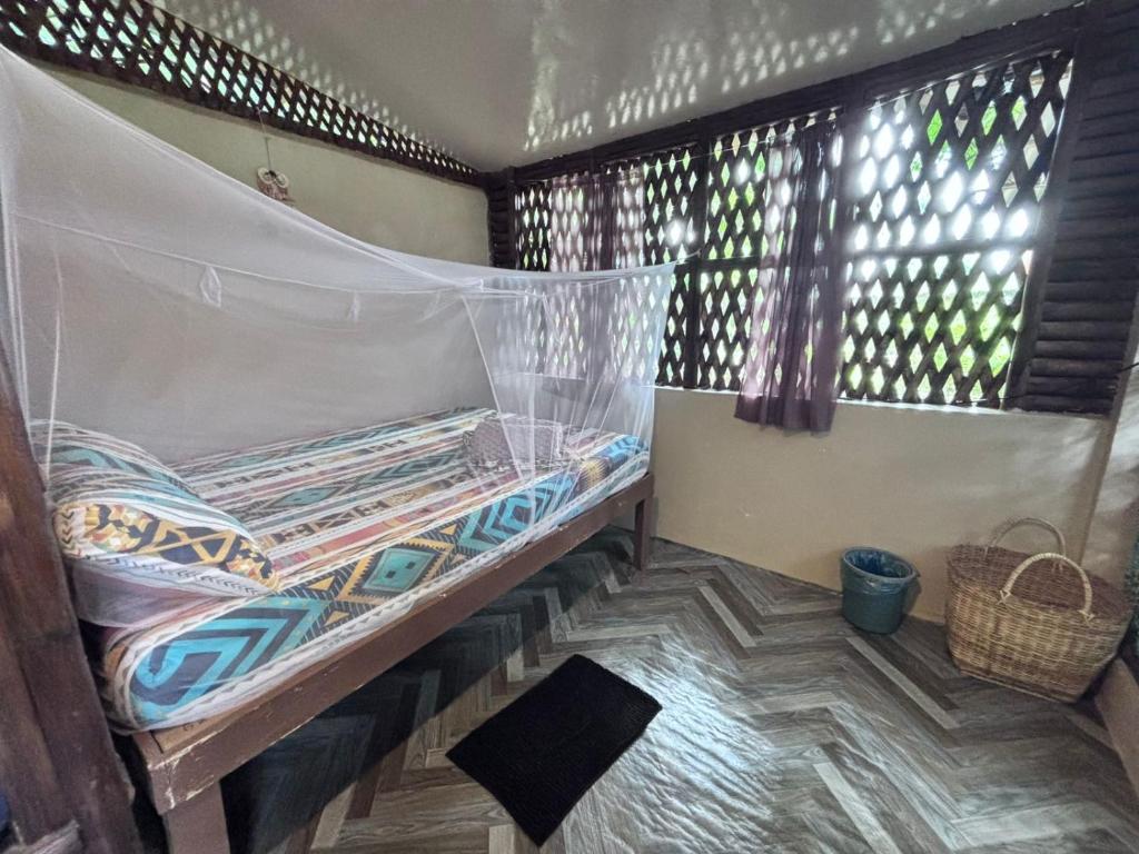Postel nebo postele na pokoji v ubytování Kusirena Homestay