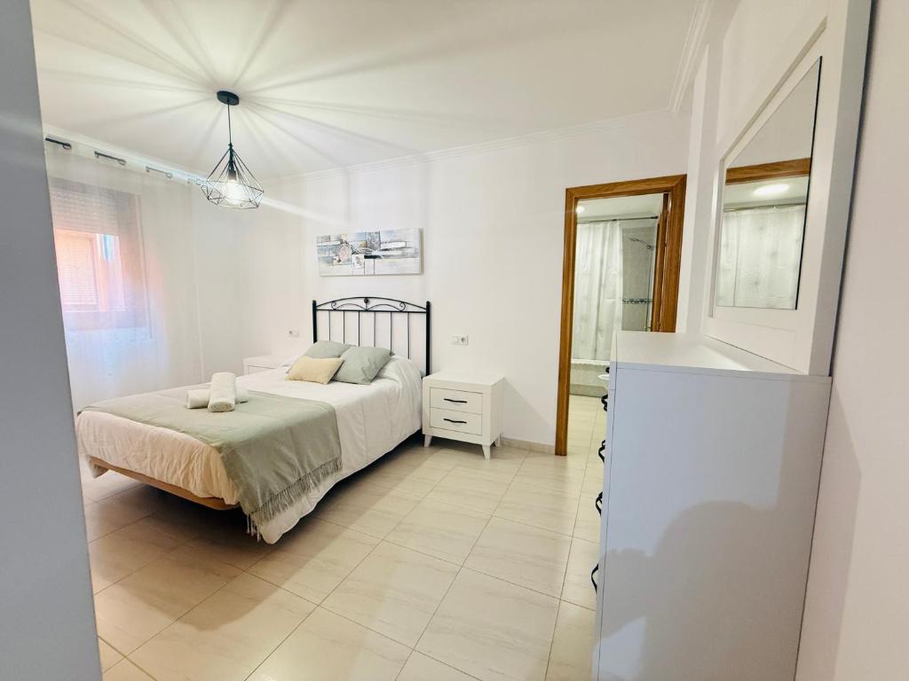 Ein Bett oder Betten in einem Zimmer der Unterkunft Bonito apartamento en la villa marinera de Portonovo