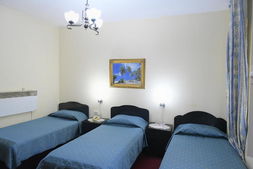 Postel nebo postele na pokoji v ubytování Hotel HAXHIU