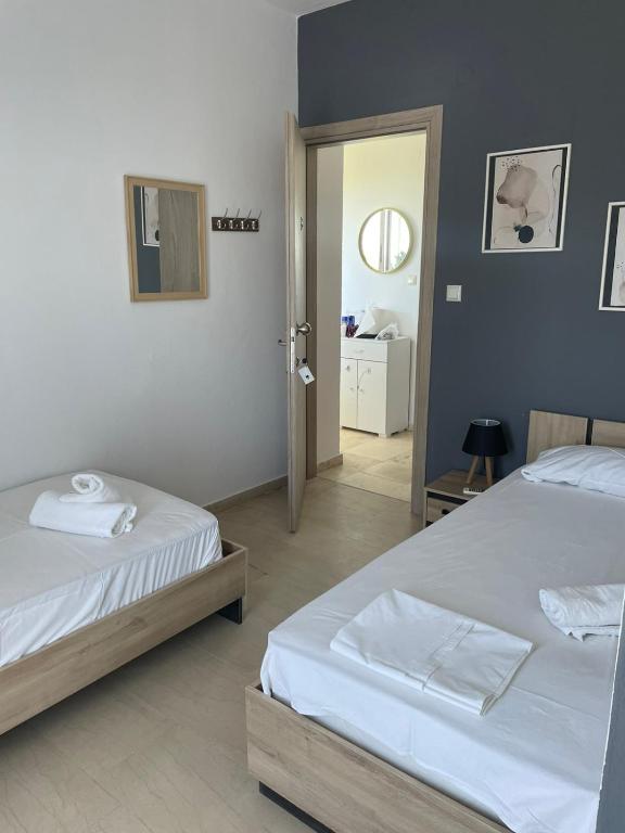 Postel nebo postele na pokoji v ubytování Vesper Rooms