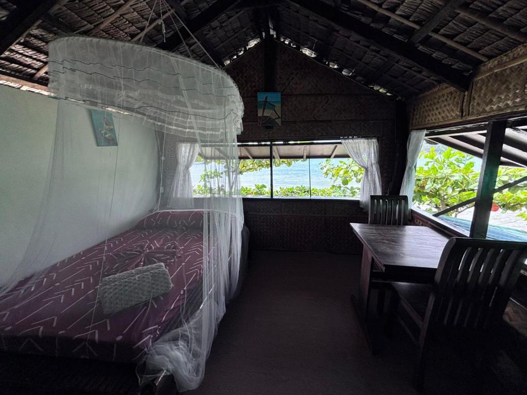 Postel nebo postele na pokoji v ubytování Kusirena Homestay