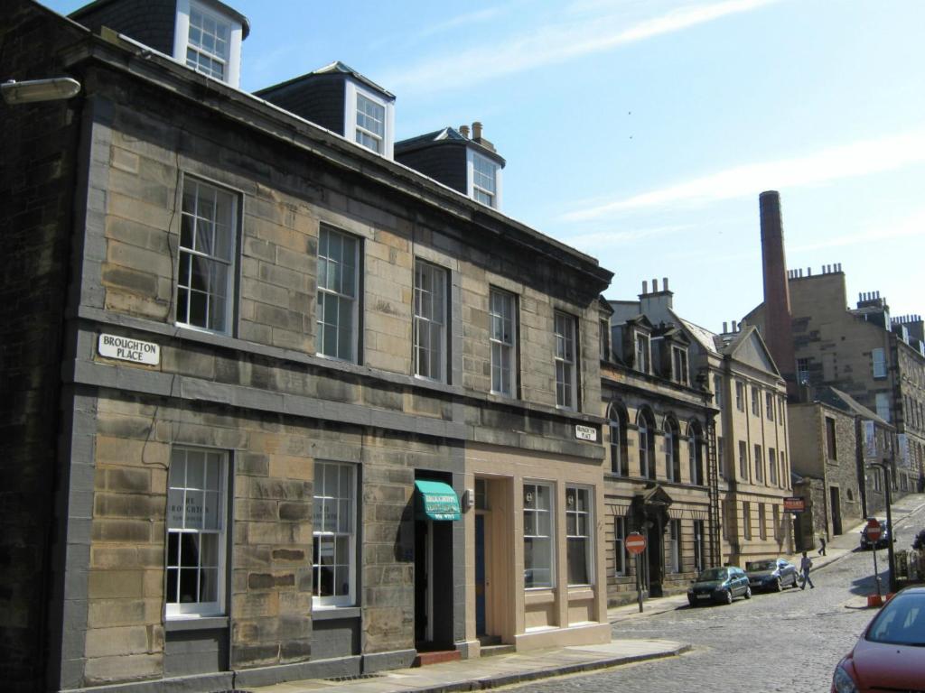 an old stone building on a city street at The Broughton Hotel in Edinburgh