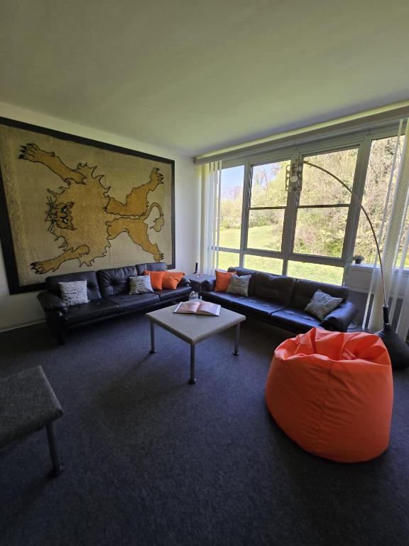 a living room with a couch and a table at Residenza Talponia 250 in Ivrea