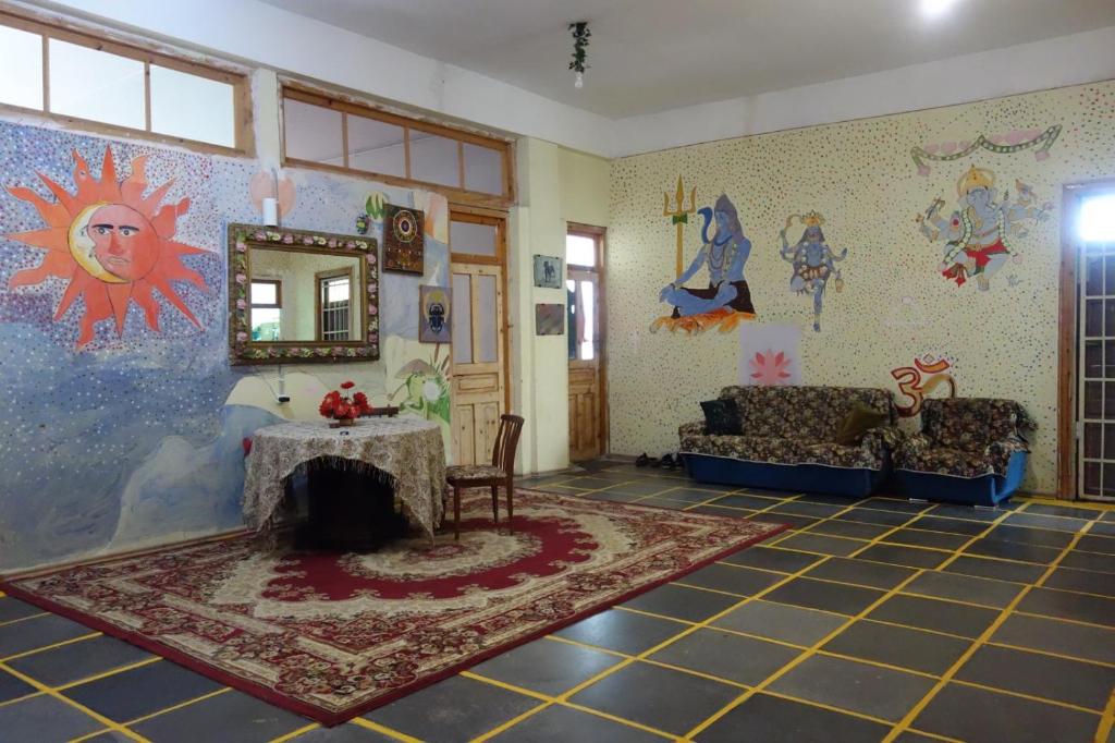 a living room with a couch and a table at Nomads Nest in Kutaisi