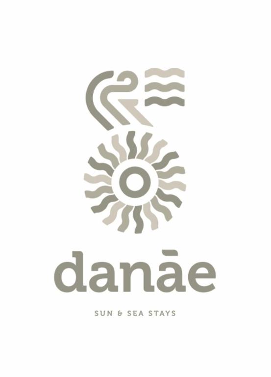 a logo for a dermatology clinic with a zebra at Danа̃e Sun&Sea Stays in Livadi