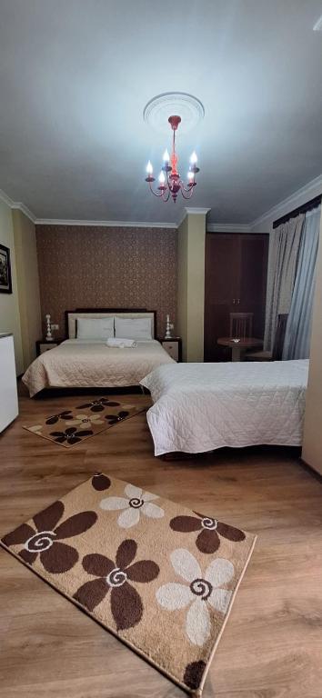 Postel nebo postele na pokoji v ubytování Hotel Theo