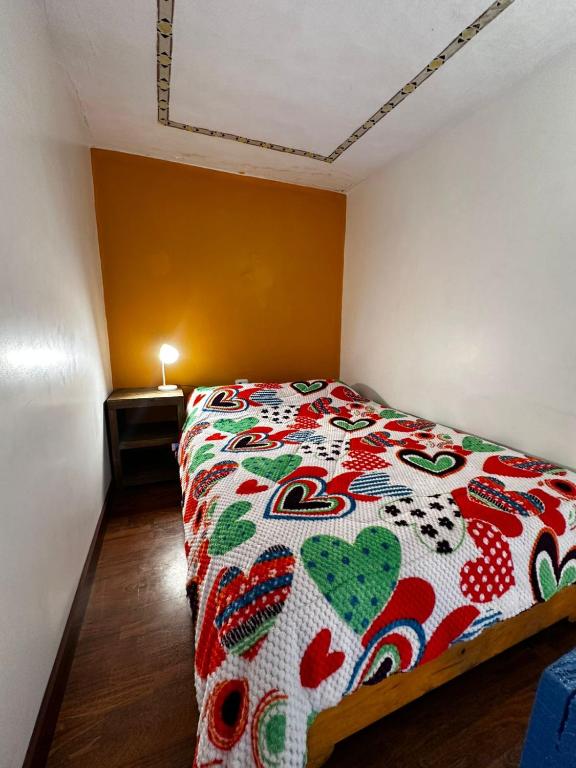 Postel nebo postele na pokoji v ubytování Hostal Café Tiana